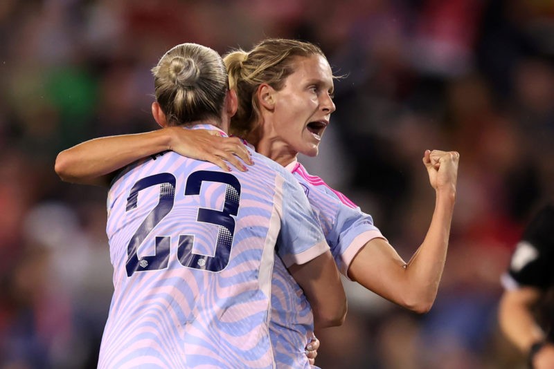 LEIGH, ENGLAND - OCTOBER 06: Cloe Lacasse of Arsenal celebrates with Alessia Russoafter scoring the team's second goal during the Barclays Women´s ...