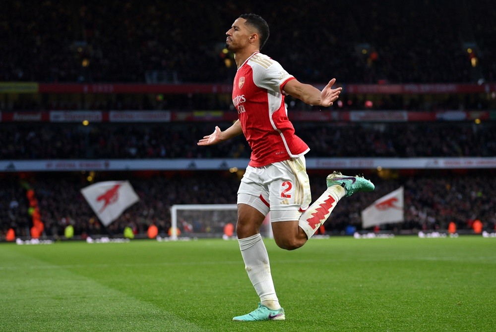 LONDON, ENGLAND: William Saliba of Arsenal celebrates after scoring the team's second goal during the Premier League match between Arsenal FC and B...