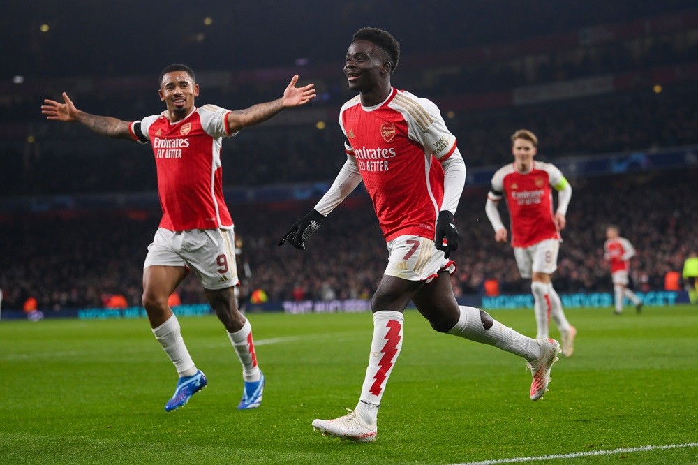 UEFA responds after EU release Super League judgement 4 LONDON, ENGLAND: Bukayo Saka of Arsenal celebrates with Gabriel Jesus after scoring his team's third goal during the UEFA Champions League match between Arsenal FC and RC Lens at Emirates Stadium on November 29, 2023. (Photo by Mike Hewitt/Getty Images)