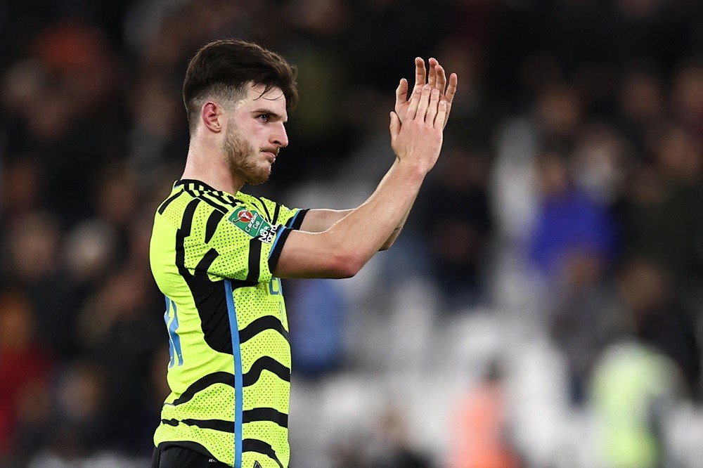Arsenal's Declan Rice applauds fans on the pitch after the English League Cup fourth round football match between West Ham United and Arsenal at Th...