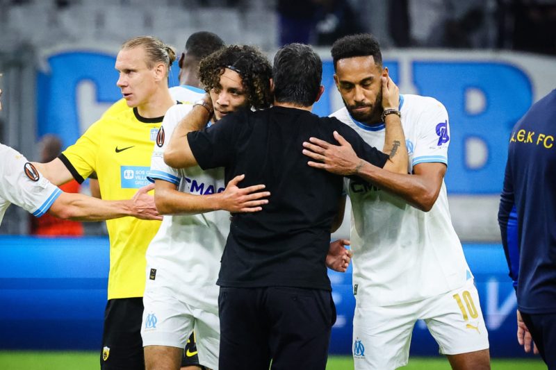 Marseille's Italian head coach Gennaro Gattuso (back) hugs Marseille's Gabonese forward #10 Pierre-Emerick Aubameyang (R) and Marseille's French mi...