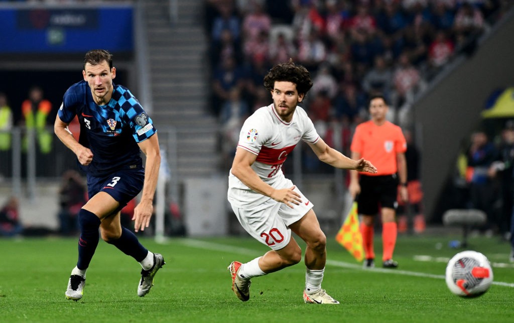 Croatia's defender #03 Borna Barisic fights for the ball with Turkey's defender #20 Ferdi Kadioglu during the UEFA Euro 2024 Group D qualification football match between Croatia and Turkey at the OPUS Arena Stadium in Osijek, on October 12, 2023. (Photo by DENIS LOVROVIC/AFP via Getty Images)