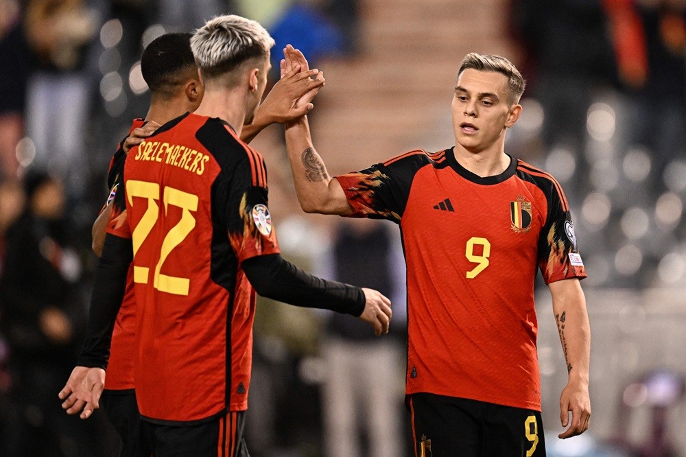 Belgium's Leandro Trossard (R) celebrates scoring his team's fifth goal during the UEFA Champions League Qualifying Group F football match between ...