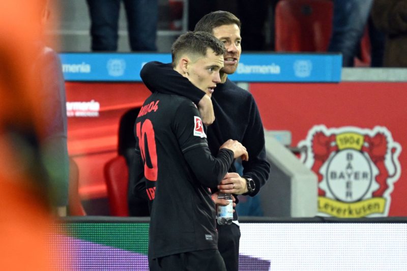 Wirtz's stellar form sparks €80m duel between Arsenal and Tottenham 2 Bayer Leverkusen's German midfielder #10 Florian Wirtz (L) speaks with Bayer Leverkusen's Spanish coach Xabi Alonso during the German first division Bundesliga football match between Bayer 04 Leverkusen and SC Freiburg in Leverkusen, western Germany on October 29, 2023. (Photo by INA FASSBENDER/AFP via Getty Images)