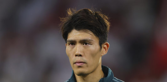 SEVILLE, SPAIN - OCTOBER 24: Takehiro Tomiyasu of Arsenal FC looks on during the UEFA Champions League match between Sevilla FC and Arsenal FC at Estadio Ramon Sanchez Pizjuan on October 24, 2023 in Seville, Spain. (Photo by Fran Santiago/Getty Images)