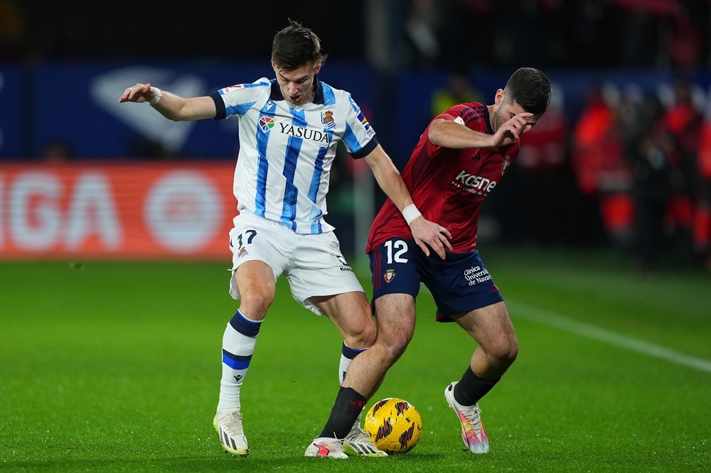 PAMPLONA, SPAIN: Kieran Tierney of Real Sociedad battles for possession with Jesus Areso of CA Osasuna during the LaLiga EA Sports match between CA...