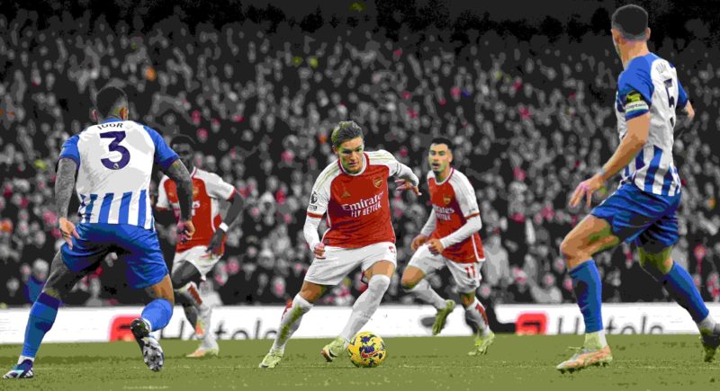 Arteta on Arsenal's need for efficiency, keeping Gabriel and more 3 Arsenal's Norwegian midfielder #08 Martin Odegaard (C) runs with the ball during the English Premier League football match between Arsenal and Brighton and Hove Albion at the Emirates Stadium in London on December 17, 2023. (Photo by JUSTIN TALLIS/AFP via Getty Images)