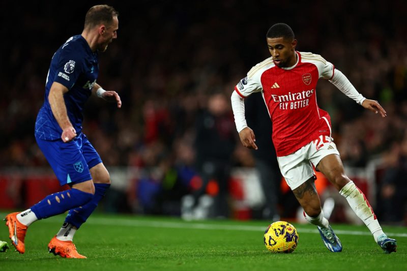 West Ham United's Czech defender #05 Vladimir Coufal (L) fights for the ball with Arsenal's English midfielder 24 Reiss Nelson during the English Premier League football match between Arsenal and West Ham at the Emirates Stadium in London on December 28, 2023. (Photo by HENRY NICHOLLS/AFP via Getty Images)