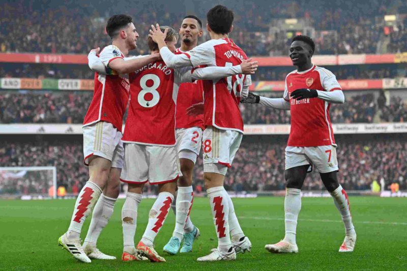 Arsenal's Norwegian midfielder #08 Martin Odegaard (2L) celebrates scoring the team's second goal during the English Premier League football match between Arsenal and Wolverhampton Wanderers at the Emirates Stadium in London on December 2, 2023. (Photo by GLYN KIRK/AFP via Getty Images)