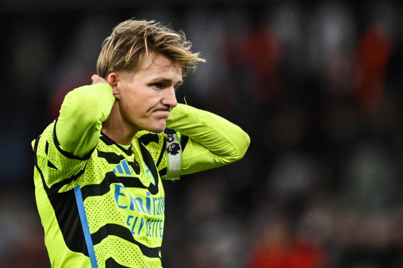 Arsenal's Norwegian midfielder #08 Martin Odegaard reacts after missing to score during the English Premier League football match between Aston Vil...