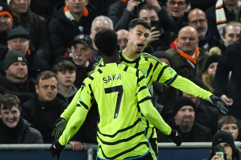Arsenal's Brazilian midfielder #11 Gabriel Martinelli (rear) celebrates after with Arsenal's English midfielder #07 Bukayo Saka scoring his team fi...