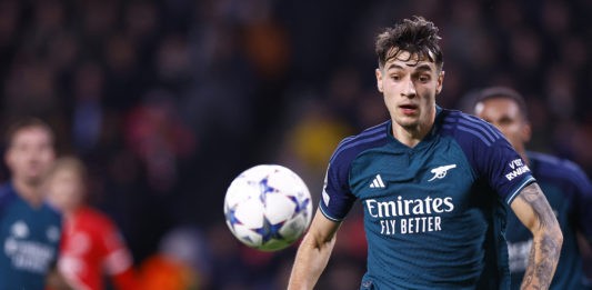 Arsenal's Polish defender #15 Jakub Kiwior eyes the ball during a UEFA Champions League group B football match between PSV Eindhoven and Arsenal FC at the Philips Stadium in Eindhoven, on December 12, 2023. (Photo by KENZO TRIBOUILLARD/AFP via Getty Images)