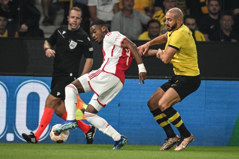 Ajax's Dutch defender #04 Jorrel Hato (L) fights for the ball with AEK's Moroccan midfielder #05 Noureddine Amrabat during the UEFA Europa League 1...