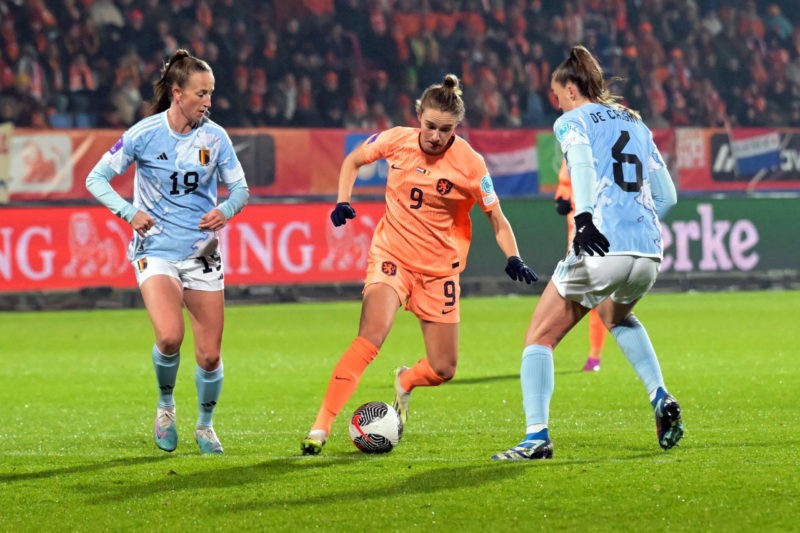 Netherlands' forward #09 Vivianne Miedema fights for the ball with Belgium's defender #19 Sari Kees and Belgium's defender #06 Tine De Caigny durin...