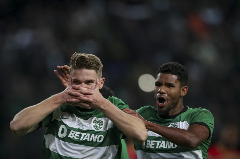 Sporting Lisbon's Swedish forward #09 Viktor Gyokeres (L) celebrates with Sporting Lisbon's Brazilian defender #02 Matheus Reis after scoring his t...