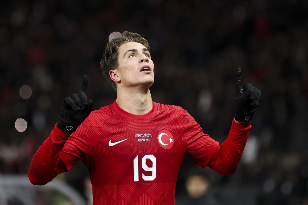 BERLIN, GERMANY: Kenan Yildiz of Turkey celebrates with team mates after scoring the team's second goal during an international friendly match betw...