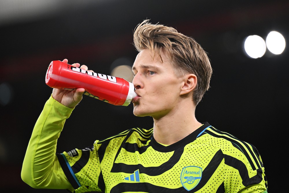 LIVERPOOL, ENGLAND: Martin Odegaard of Arsenal has a drink prior to the Premier League match between Liverpool FC and Arsenal FC at Anfield on Dece...