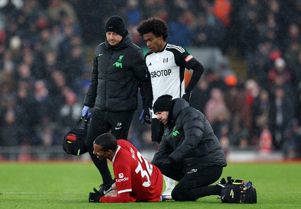 LIVERPOOL, ENGLAND: Joel Matip of Liverpool receives medical treatment during the Premier League match between Liverpool FC and Fulham FC at Anfiel...