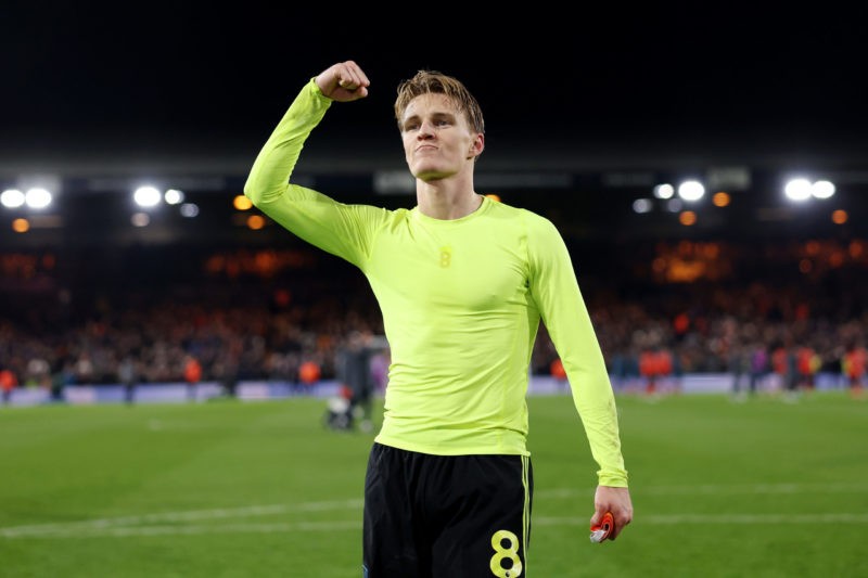LUTON, ENGLAND - DECEMBER 05: Martin Odegaard of Arsenal celebrates victory in front of the fans of Arsenal after the Premier League match between ...