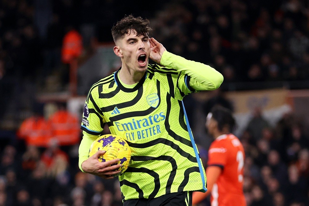 LUTON, ENGLAND: Kai Havertz of Arsenal celebrates after scoring the team's third goal during the Premier League match between Luton Town and Arsena...