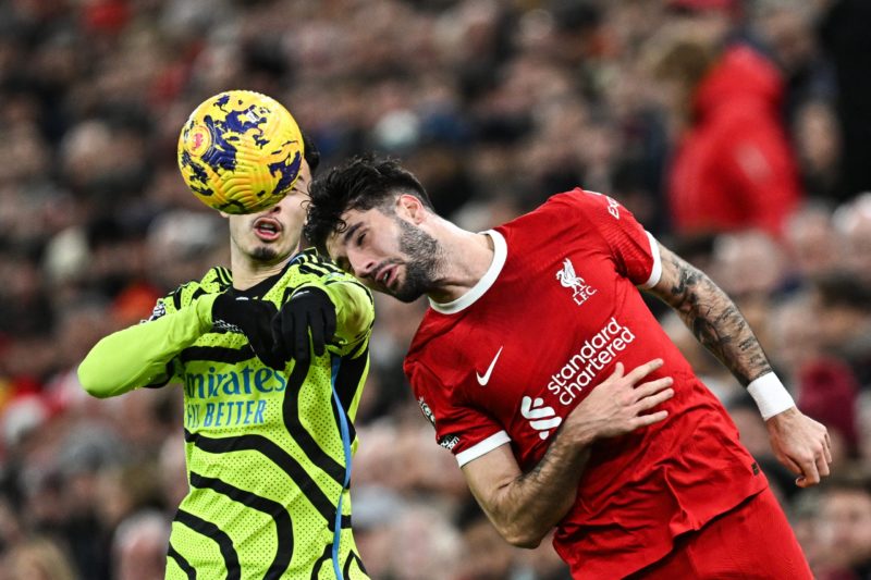 Boost as Liverpool midfielder ruled out of Arsenal FA Cup clash 2 Arsenal's Brazilian midfielder #11 Gabriel Martinelli (L) fights for the ball with Liverpool's Hungarian midfielder #08 Dominik Szoboszlai during the English Premier League football match between Liverpool and Arsenal at Anfield in Liverpool, north west England on December 23, 2023. (Photo by PAUL ELLIS/AFP via Getty Images)