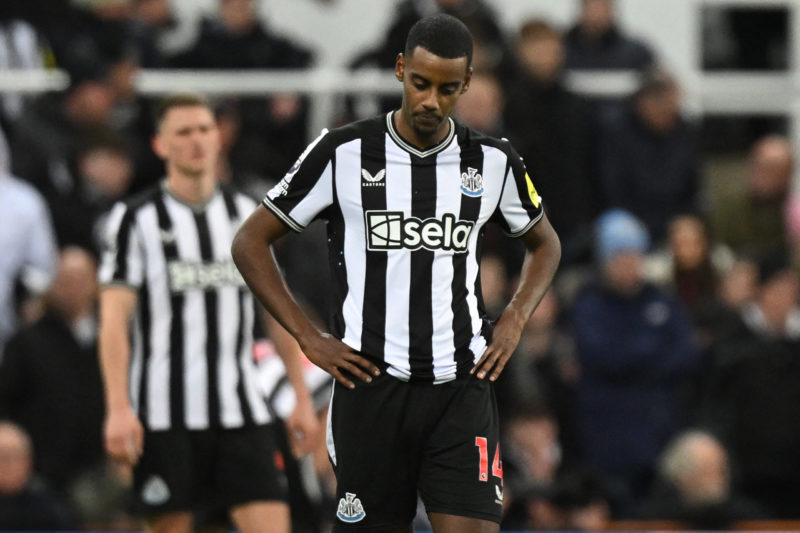 Newcastle United's Swedish striker #14 Alexander Isak reacts after they concede their third goal during the English Premier League football match b...