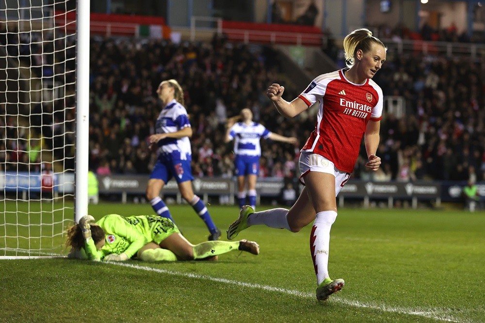 READING, ENGLAND: Stina Blackstenius of Arsenal celebrates scoring her team's sixth goal and her third goal to complete the hat-trick during the FA...