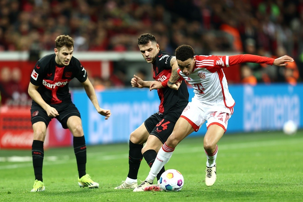 Former Gunner embarrasses ex-Spurs duo in 3-0 title race thrashing 3 LEVERKUSEN, GERMANY: Granit Xhaka of Bayer Leverkusen battles for possession with Jamal Musiala of Bayern Munich during the Bundesliga match between Bayer 04 Leverkusen and FC Bayern München at BayArena on February 10, 2024. (Photo by Leon Kuegeler/Getty Images)