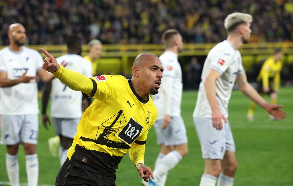 DORTMUND, GERMANY: Donyell Malen of Borussia Dortmund celebrates scoring his team's first goal during the Bundesliga match between Borussia Dortmun...