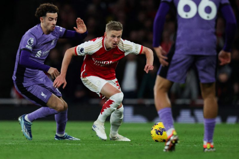 Liverpool's English midfielder #17 Curtis Jones (L) fights for the ball with Arsenal's Ukrainian defender #35 Oleksandr Zinchenko during the Englis...