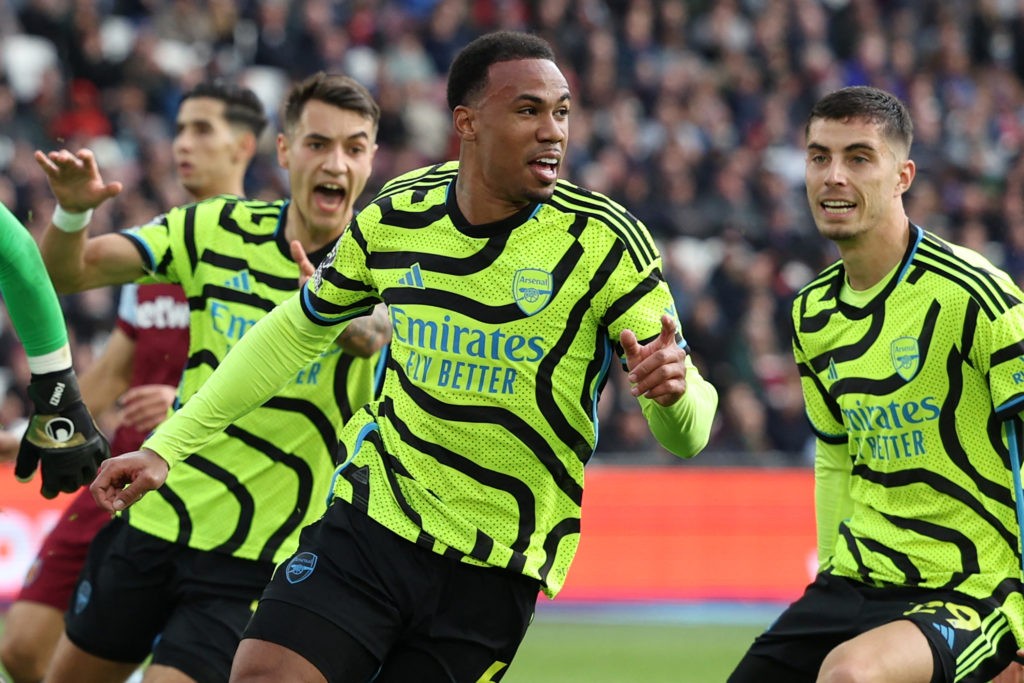 Arsenal's Brazilian defender #06 Gabriel Magalhaes (C) celebrates after scoring their third goal during the English Premier League football match between West Ham United and Arsenal at the London Stadium, in London on February 11, 2024. (Photo by ADRIAN DENNIS/AFP via Getty Images)