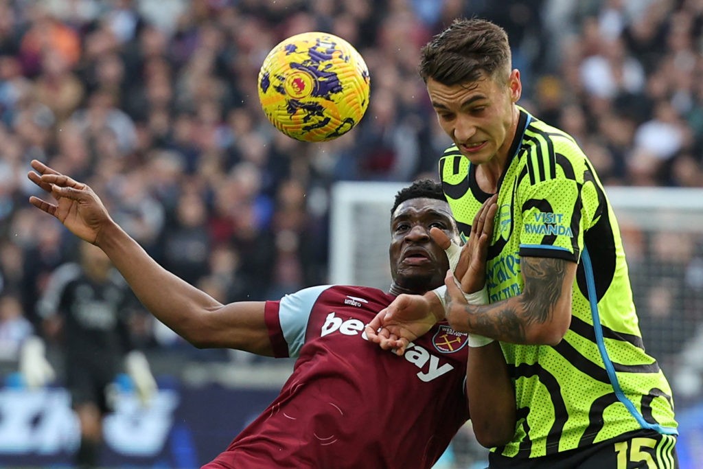 West Ham United's Ghanaian midfielder #14 Mohammed Kudus (L) vies with Arsenal's Polish defender #15 Jakub Kiwior (R) during the English Premier League football match between West Ham United and Arsenal at the London Stadium, in London on February 11, 2024. (Photo by ADRIAN DENNIS/AFP via Getty Images)