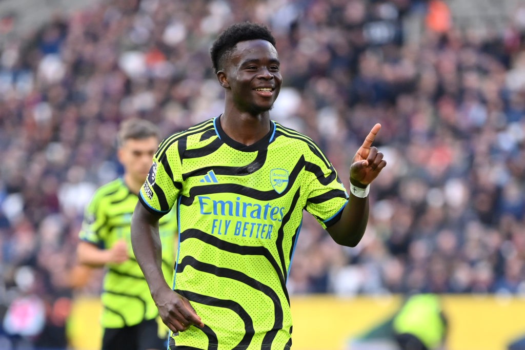 LONDON, ENGLAND - FEBRUARY 11: Bukayo Saka of Arsenal celebrates scoring his team's fifth goal during the Premier League match between West Ham United and Arsenal FC at London Stadium on February 11, 2024 in London, England. (Photo by Justin Setterfield/Getty Images)