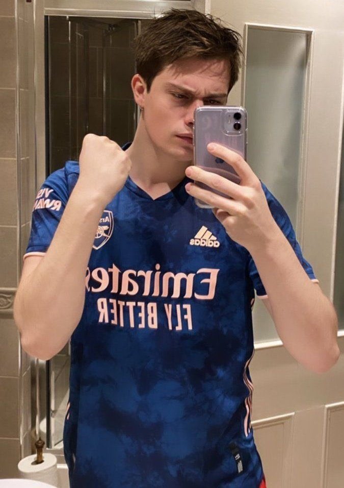 Nicholas Galitzine wearing an Arsenal shirt