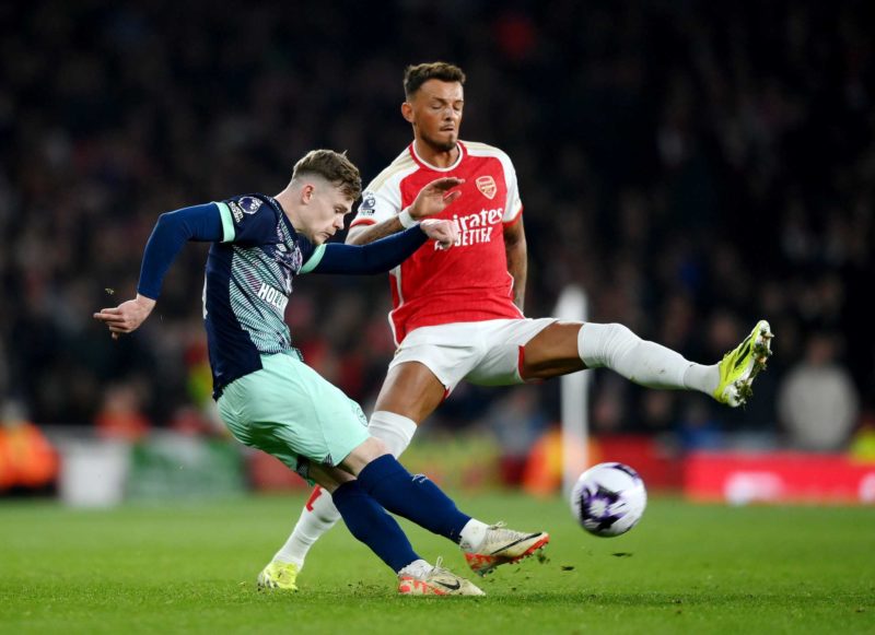 Keane Lewis-Potter of Brentford is put under pressure by Ben White of Arsenal during the Premier League match between Arsenal FC and Brentford FC a...