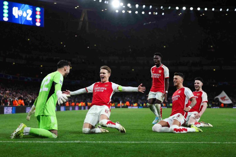 Arsenal's squad value drops but still 2nd highest in world 2 (From L) Arsenal's Spanish goalkeeper #22 David Raya, Arsenal's Norwegian midfielder #08 Martin Odegaard, Arsenal's English midfielder #07 Bukayo Saka, Arsenal's English defender #04 Ben White and Arsenal's English midfielder #41 Declan Rice celebrate after winning the penalty shoot-out session of the UEFA Champions League last 16 second leg football match between Arsenal and Porto FC at the Arsenal Stadium in north London, on March 12, 2024. Arsenal edged out Porto on penalties to reach the Champions League quarter-finals for the first time since 2010. (Photo by ADRIAN DENNIS/AFP via Getty Images)