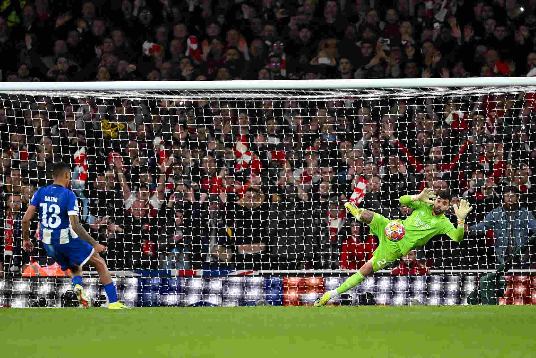 David Raya of Arsenal makes the match-winning save from the fourth penalty from Galeno of FC Porto in the penalty shoot out during the UEFA Champio...