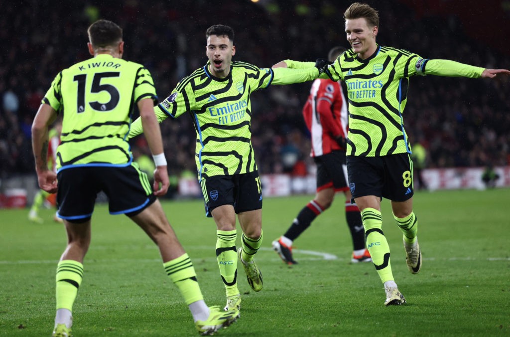 Gabriel Martinelli and Martin Ødegaard celebrate a goal with Jakub Kiwior (Photo via Getty Images)