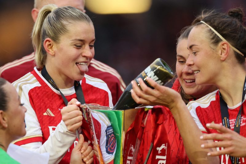 Arsenal clinch Conti Cup after Maanum collapses 4 Arsenal's English striker #23 Alessia Russo (L) waits to take a drink from the trophy as Arsenal's players celebrate their win after the English Women's League Cup final football match between Arsenal and Chelsea at Molineux in Wolverhampton, central England on March 31, 2024. Arsenal won the game 1-0 after extra time. (Photo by Adrian DENNIS / AFP) (Photo by ADRIAN DENNIS/AFP via Getty Images)
