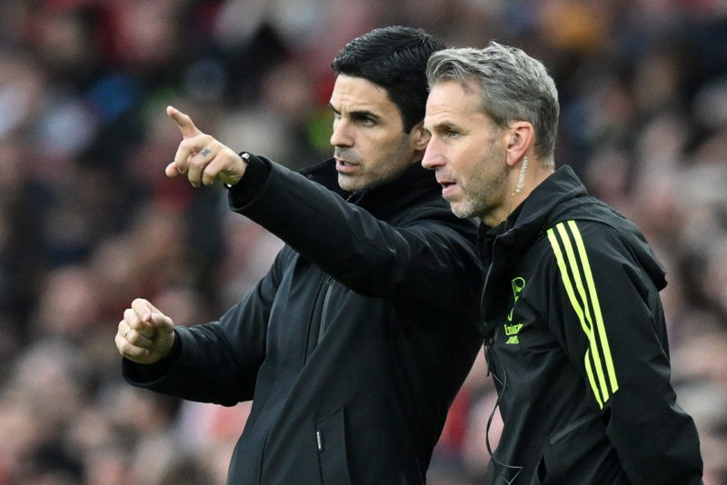 Arsenal's Spanish manager Mikel Arteta (L) speaks with Arsenal's Dutch assistant coach Albert Stuivenberg (R) during the English Premier League foo...