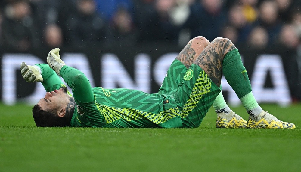 Manchester City's Ederson reacts before leaving the pitch injured during the English Premier League football match between Liverpool and Manchester...