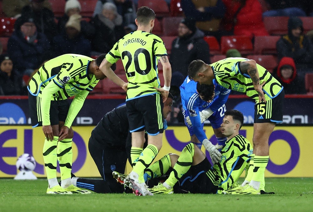 Arsenal's Gabriel Martinelli receives medical treatment during the English Premier League football match between Sheffield United and Arsenal at Br...