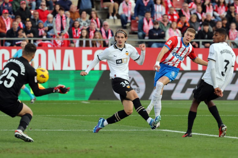 Could Yarek Gasiorowski be the next young star to join Arsenal? 2 Girona's Ukrainian forward #09 Artem Dovbyk (2R) shoots beside Valencia's Spanish defender #34 Yarek Gasiorowski and Valencia's Georgian goalkeeper #25 Giorgi Mamardashvili sves the ball during the Spanish league football match between Girona FC and Valencia CF at the Montilivi stadium in Girona on December 1, 2023. (Photo by LLUIS GENE/AFP via Getty Images)