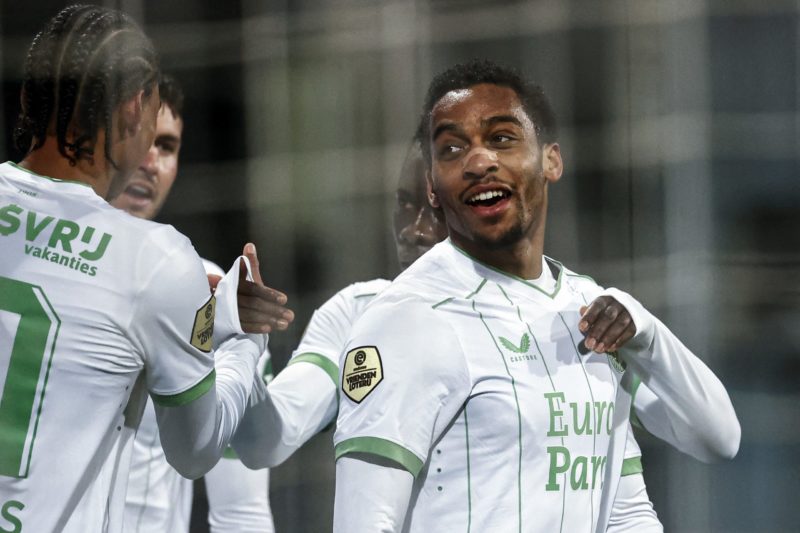 Feyenoord's Dutch midfielder #08 Quinten Timber (R) celebrates after scoring his team's third goal during the Dutch Eredivisie football match between between Excelsior Rotterdam and Feyenoord at the Van Donge and De Roo Stadium in Rotterdam, on November 25, 2023. Netherlands OUT (Photo by MAURICE VAN STEEN/ANP/AFP via Getty Images)