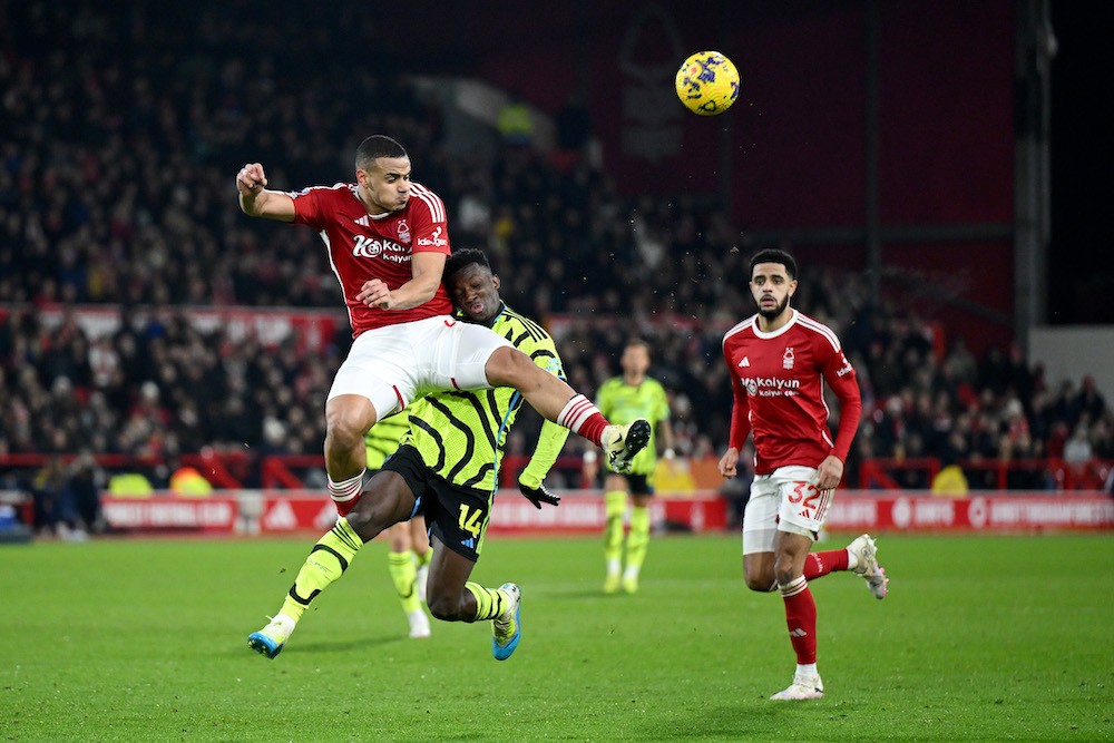 NOTTINGHAM, ENGLAND: Eddie Nketiah of Arsenal is challenged by Murillo of Nottingham Forest during the Premier League match between Nottingham Fore...