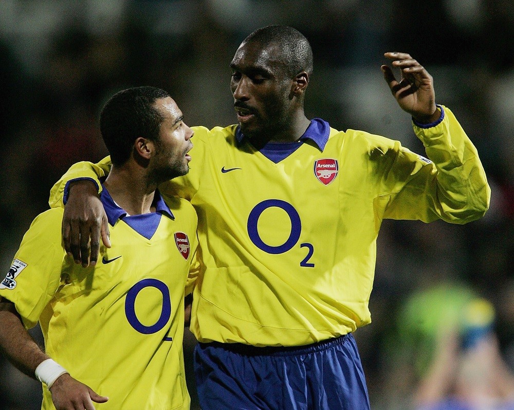 PORTSMOUTH, ENGLAND: Ashley Cole congratulates Sol Campbell, the goal scorer at the end of the Barclays Premiership match between Portsmouth and Ar...