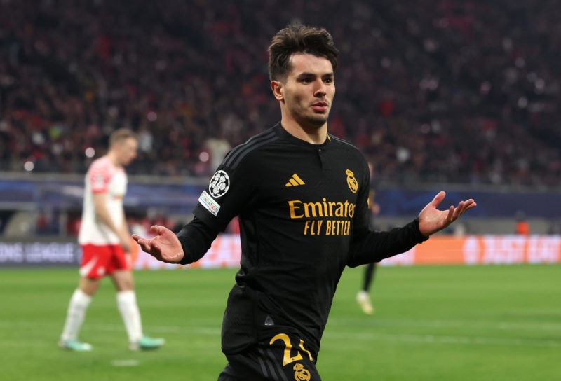 LEIPZIG, GERMANY - FEBRUARY 13: Brahim Diaz of Real Madrid celebrates scoring his team's first goal during the UEFA Champions League 2023/24 round ...