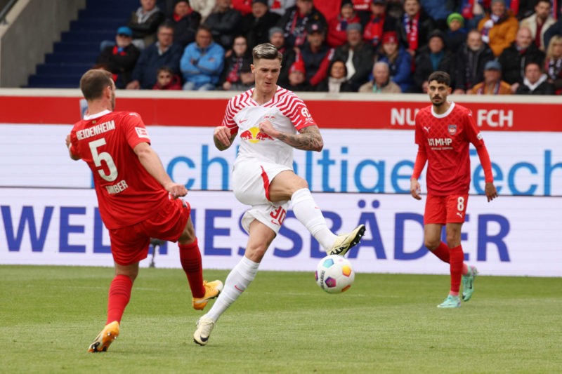 HEIDENHEIM, GERMANY - APRIL 20: Benjamin Sesko of RB Leipzig scores his team's first goal during the Bundesliga match between 1. FC Heidenheim 1846...