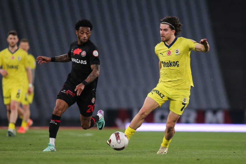 ISTANBUL, TURKEY - April 14: Ferdi Kadioglu of Fenerbahce is challenged by Ryan Mendes of Fatih Karagumruk during the Turkish Super League match between Fatih Karagumruk and Fenerbahce at Ataturk Olympic Stadium on April 14, 2024 in Istanbul, Turkey. (Photo by Ahmad Mora/Getty Images)