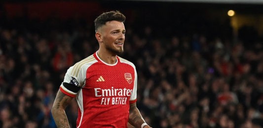 Arsenal's English defender #04 Ben White celebrates after scoring their fifth goal during the English Premier League football match between Arsenal and Chelsea at the Emirates Stadium in London on April 23, 2024. (Photo by GLYN KIRK/AFP via Getty Images)